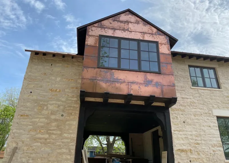 Copper metal panel facade on a stone building for Roof Repair in Montecito