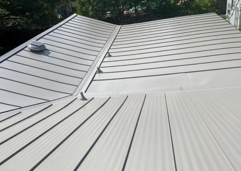 Solar attic fan installed on a metal roof for Roof Ventilation in Montecito